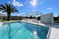 Modern 3+1 bedroom villa with pool close to the beach and amenities