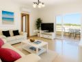 Modern top floor 2-bed apartment with large private roof terrace in Tavira